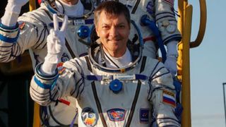 Oleg Kononenko boarding a rocket