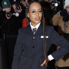 Kerry Washington wearing a pinstriped skirt and jacket arrives at the Thom Browne show during New York Fashion Week on February 11, 2025 in New York City.