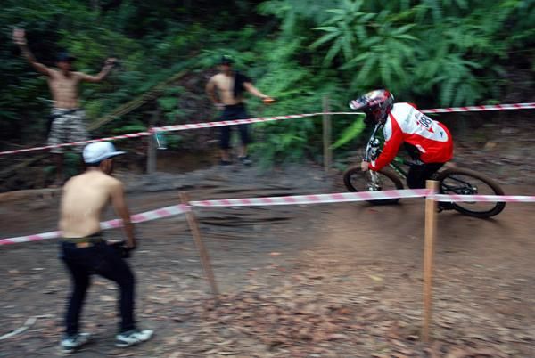 An elite men's downhill competitor gets some encouragement.
