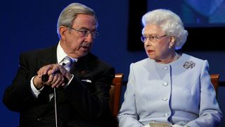 Queen Elizabeth II speaks with King Constantine of Greece during the opening ceremony of the Round Square International Conference