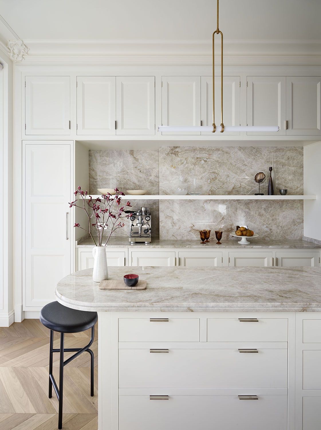 kitchen with white cabinets that reach to the ceiling