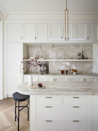 kitchen with white cabinets that reach to the ceiling