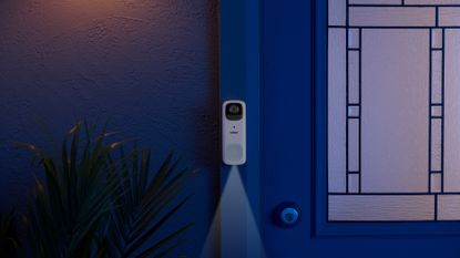 Lorex 2K Wi-Fi Video Doorbell lifestyle on blue background