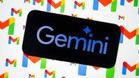 A view of the Gemini logo displayed on a mobile phone screen with Gmail logos displayed on a digital screen in the background.