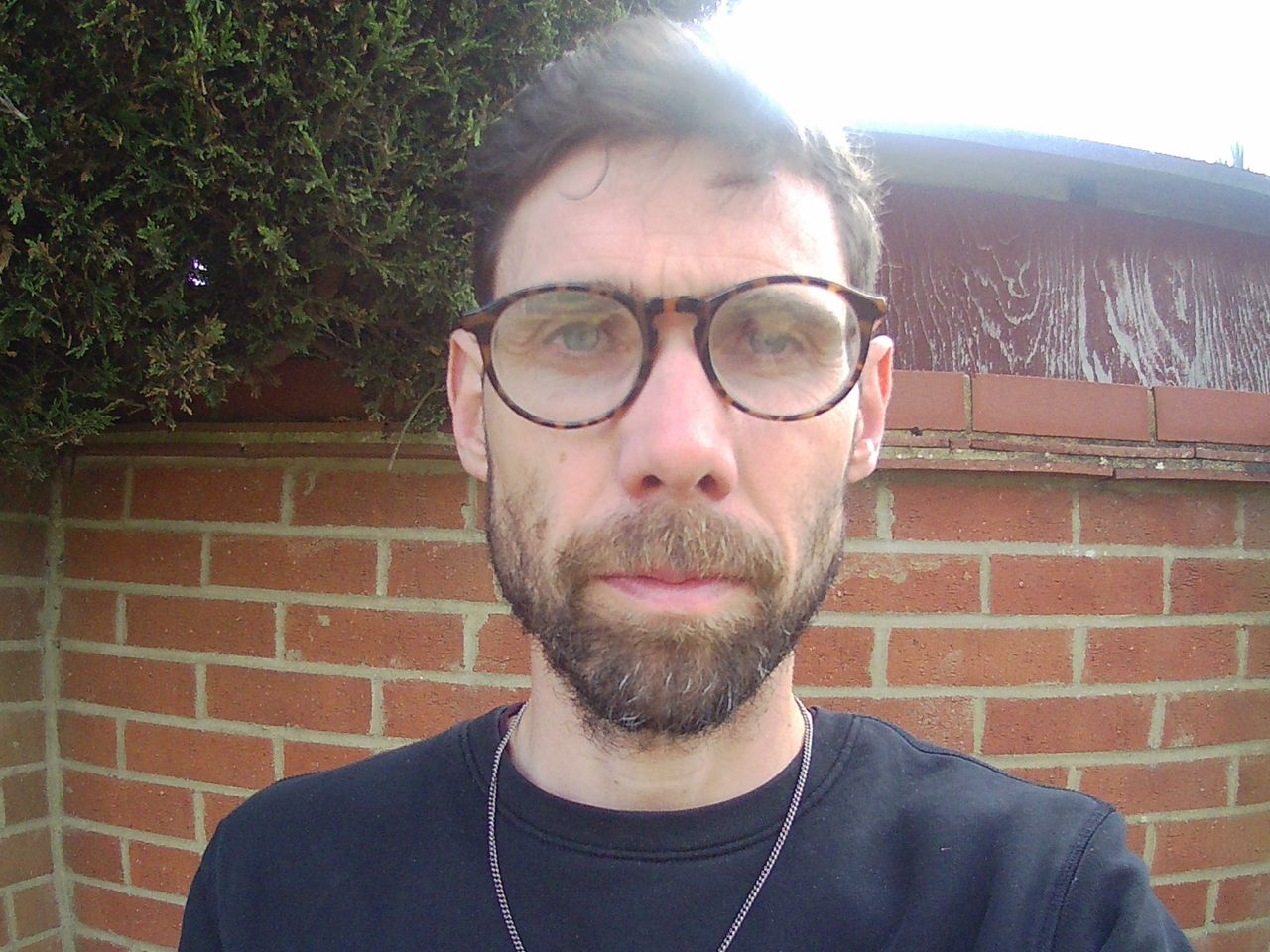 picture of a man with glasses taken with the AeroTek T03 2K