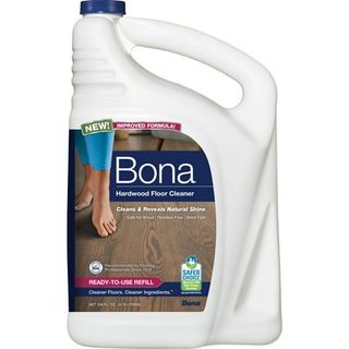 A white plastic bottle of Bona hardwood floor cleaner, with a blue screw cap lid and a built-in handle. 