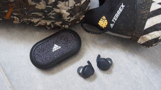 the adidas fwd-02 sport wireless earbuds with their charging case