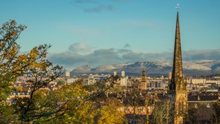 The city of Glasgow with mountains in the background