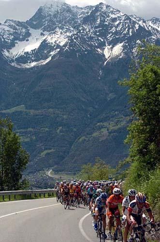 Riders are dwarfed by some massive mountains en route to Domodossola