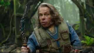 Warwick Davis' Willow talks to someone off camera in the character's Disney Plus show