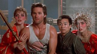 Kurt Russell holding a spear with others in Big Trouble in Little China