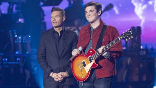 Ryan Seacrest stands with Slater Nalley, a contestant on American Idol Season 23.