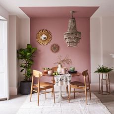 pink wall in dining area
