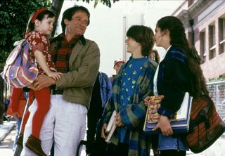 Robin Williams on the set of 'Mrs. Doubtfire' alongside his child co-stars.