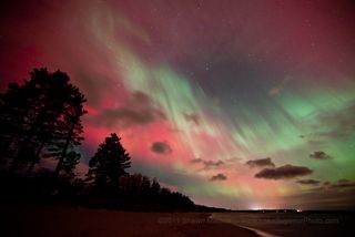 This spectacular photo of red, pink and green auroras on Oct. 24, 2011 was taken by photographer Shawn Malone of Marquette, Michigan, from the shore of Lake Superior