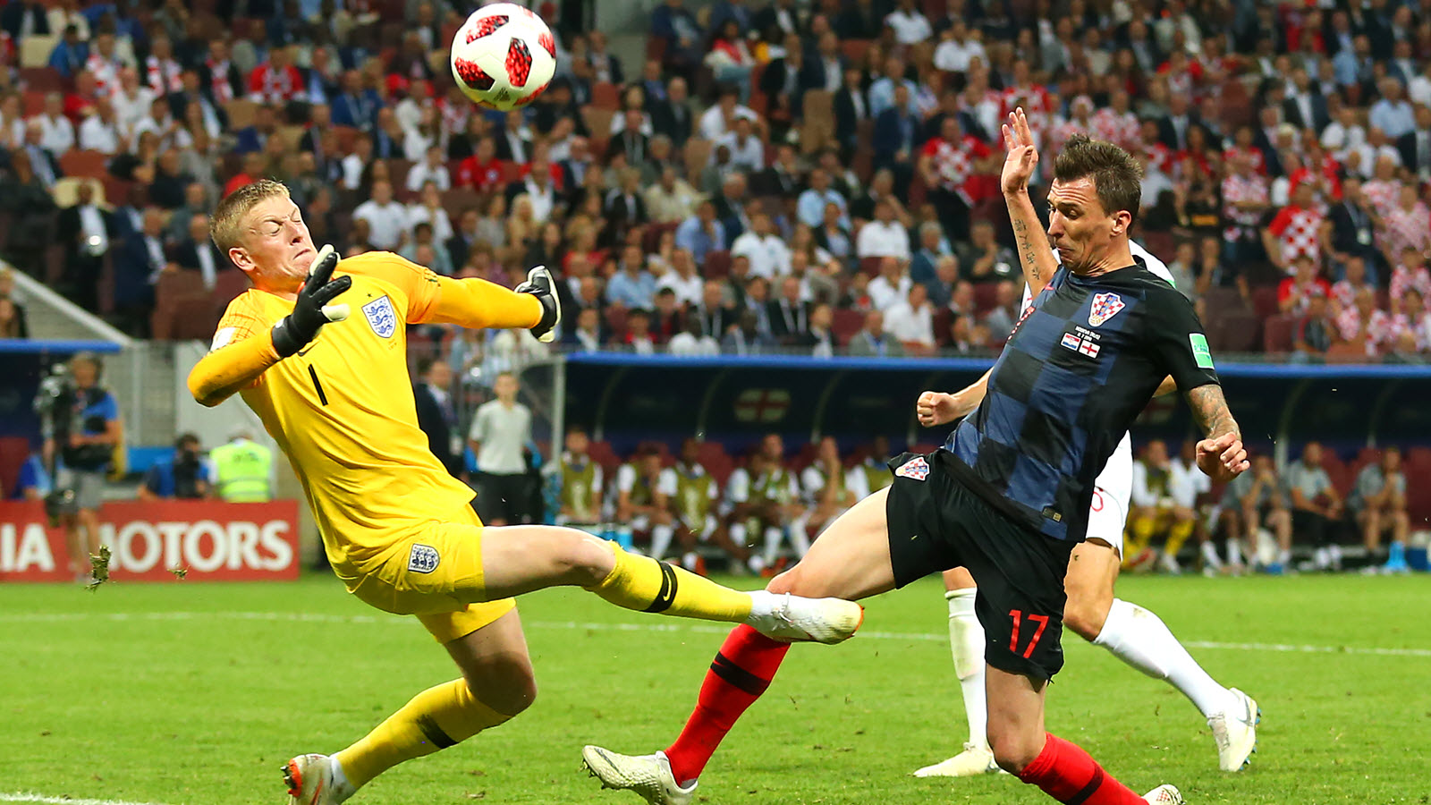 Jordan Pickford of England stops the attempt on goal of Mario Mandzukic of Croatia in extra time during their teams' 2018 FIFA World Cup Russia semifinal match Luzhniki Stadium on July 11 in Moscow.