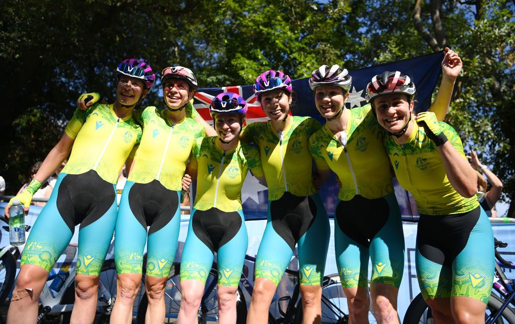 Georgia Baker celebrates winning the women's Commonwealth Games road race with her Australian teammates