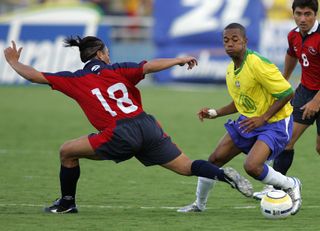 Brazil's Robinho goes past Chile's Rodrigo Araya at the 2006 World Cup.