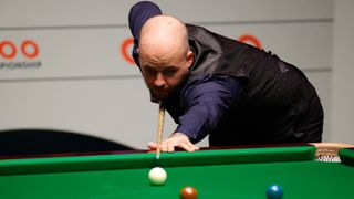 Luca Brecel of Belgium plays a shot in the final match against Mark Selby in the 2023 Cazoo World Championship at Crucible Theatre