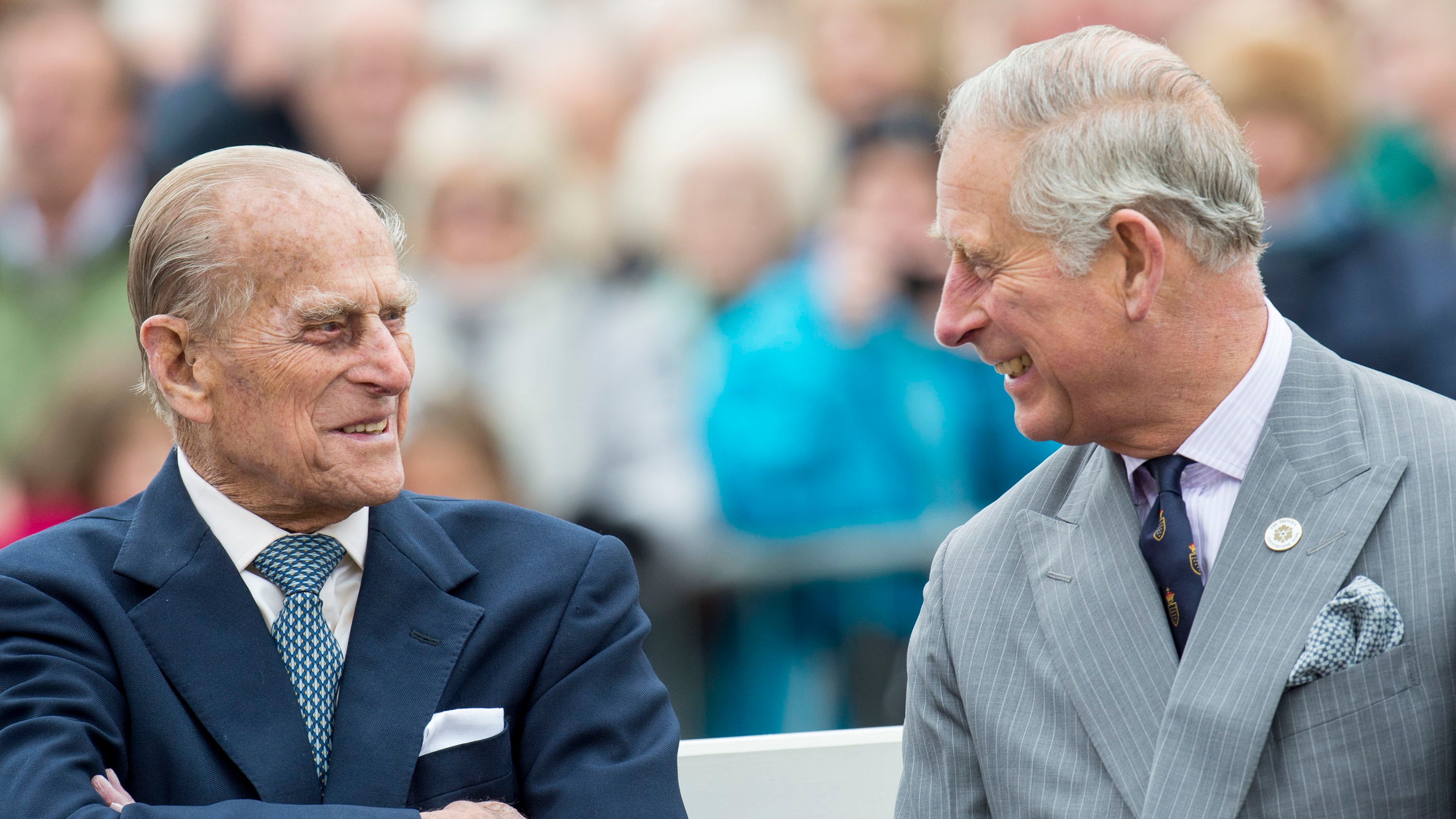 Prince Philip, Duke of Edinburgh and King Charles look at each other as they attend the unveiling of a statue of Queen Elizabeth The Queen Mother during a visit to Poundbury, Dorset, October 27, 2016