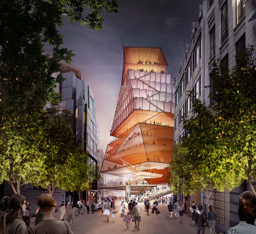 The exterior view of the London Centre for Music. A modern-looking building that's shaped like a triangle. We see the interior through the walls being all glass.