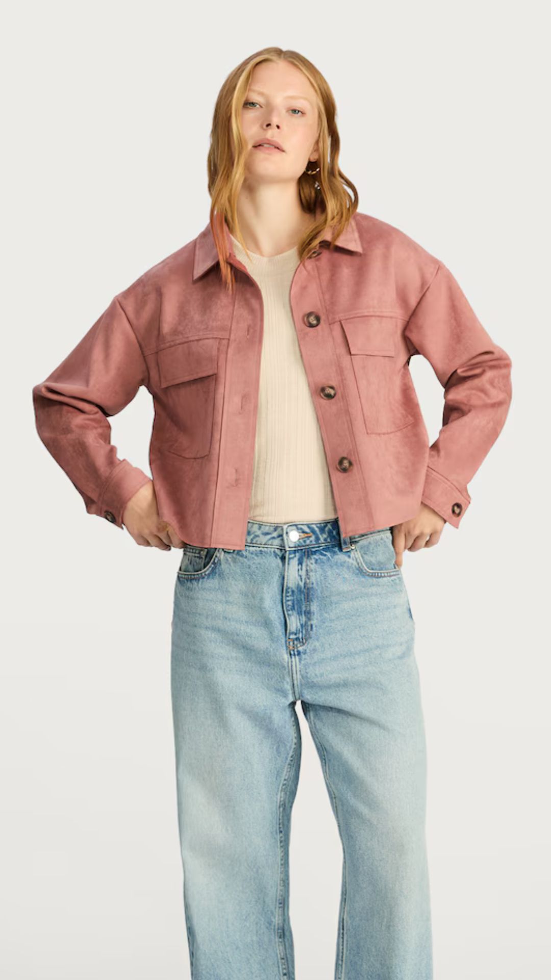 a model wearing an F&F pink faux suede jacket