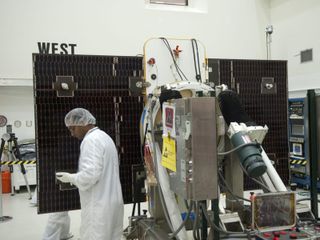 Technicians at Astrotech payload processing facility in Titusville, Fla., are conducting solar panel deployment tests on NASA's Gravity Recovery and Interior Laboratory, or GRAIL, twin spacecraft, on June 18, 2011.