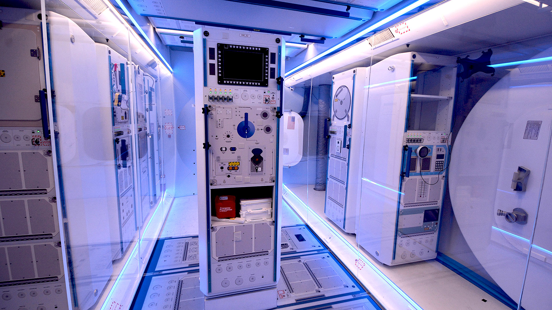 The interior of Northrop Grummann's lunar orbit habitat mockup includes science racks, docking ports and astronaut crew quarters in a layout similar to the International Space Station.