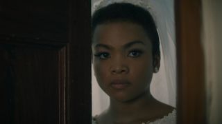 Mia Isaac as Covey in a wedding dress in Black Cake