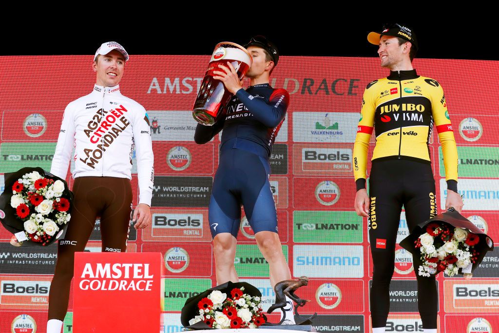VALKENBURG NETHERLANDS APRIL 10 LR Benoit Cosnefroy of France and AG2R Citren Team on second place race winner Michal Kwiatkowski of Poland and Team INEOS Grenadiers and Tiesj Benoot of Belgium and Team Jumbo Visma on third place celebrate with beer on the podium during the podium ceremony after the 56th Amstel Gold Race 2022 Mens Elite a 2541km one day race from Maastricht to Valkenburg AGR2022 WorldTour on April 10 2022 in Valkenburg Netherlands Photo by Bas CzerwinskiGetty Images