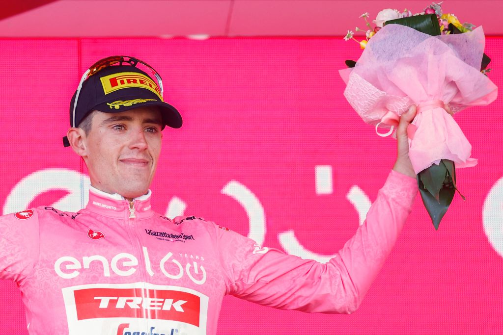 New overall leader Team Treks Spanish rider Juan Pedro Lopez celebrates on the podium after the 4th stage of the Giro dItalia 2022 cycling race 172 kilometers between Avola and EtnaNicolosi Sicily on May 10 2022 Photo by Luca Bettini AFP Photo by LUCA BETTINIAFP via Getty Images