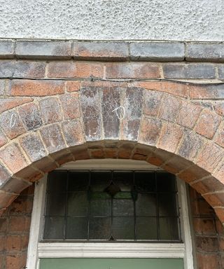 Chicken wire arch above a doorway