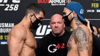 Rodolfo Vieira and Anthony Hernandez facing off at the UFC 258 weigh in.