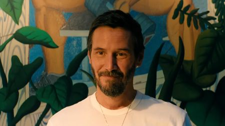 Keanu reeves smiling in Outcome