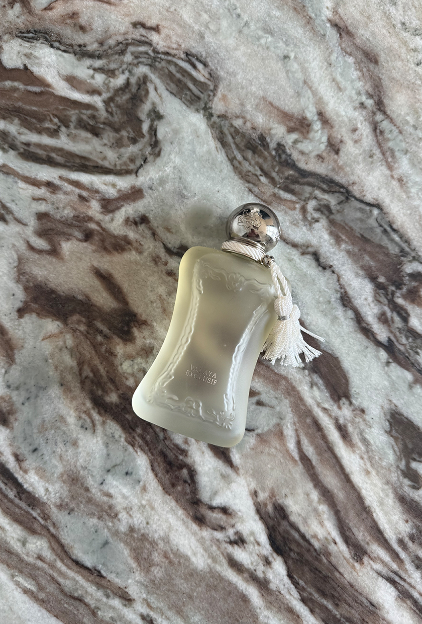 A photo of Parfums de Marly Valaya Exclusif perfume on a marble table