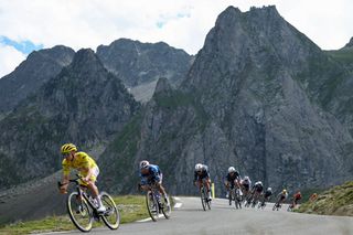 UAE Team Emirates team's Slovenian rider Tadej Pogacar wearing the overall leader's yellow jersey cycles in the descent of Col du Tourmalet during the 14th stage of the 111th edition of the Tour de France cycling race, 151,9 km between Pau and Saint-Lary-Soulan Pla d'Adet, in the Pyrenees mountains in southwestern France, on July 13, 2024. (Photo by Anne-Christine POUJOULAT / AFP)