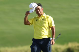 Hideki Matsuyama waves his hat to the crowds