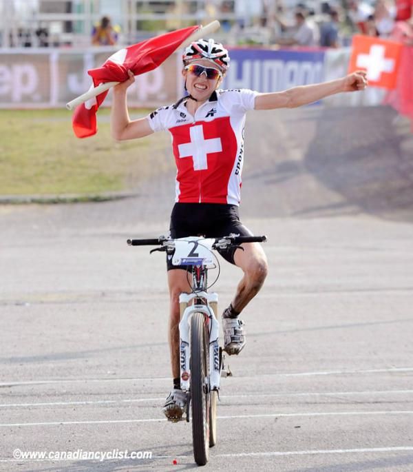 Mathias Fl&uuml;ckiger (Switzerland) celebrates his victory in the Under 23 men's cross country world championship race