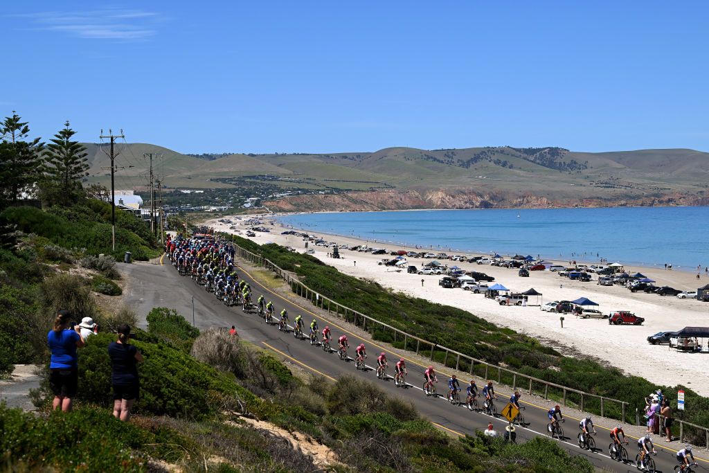 Peloton races by the beach