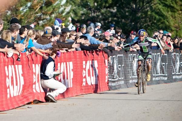 Tim Johnson (Cannondale-Cyclocrossworld.com) gets congratulated by fans as his comes in for the win.