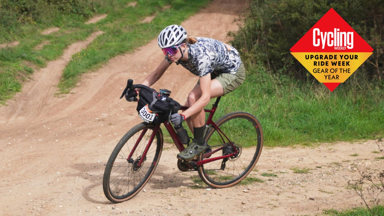 Image shows Anna Marie Abram riding on gravel