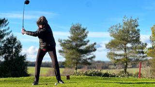 Female golfer hitting a driver