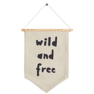 A wall hanging that says 'wild and free'