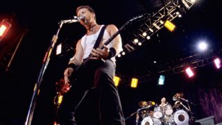 James Hetfield (L) of Metallica performs as part of Lollapalooza 1996 at Winnebago County Fairgrounds on June 30, 1996 in Rockford, Illinois