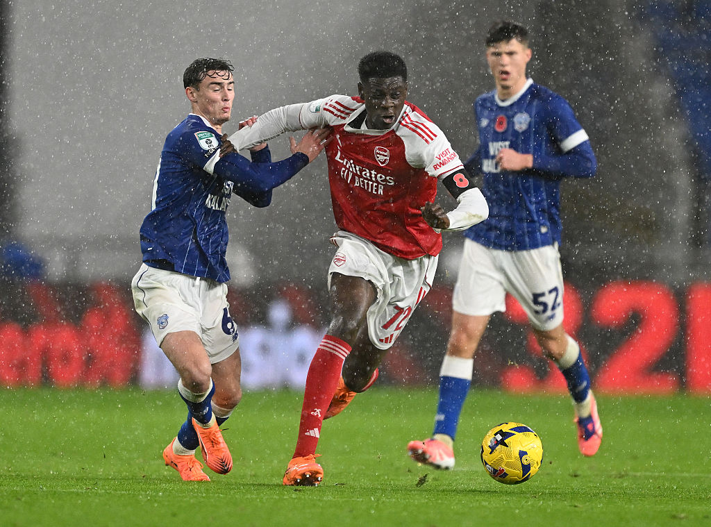 Ife Ibrahim of Arsenal takes on Cody Twose of Cardiff during the Vertu EFL Trophy match between Cardiff City and Arsenal U21 at Cardiff City Stadium on November 11, 2025 in Cardiff, Wales.