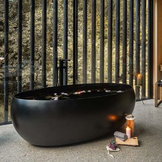 freestanding black bath in wildwood spa