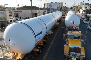Two 36-wheel transporters towed by semi-trailer trucks delivered a pair of space shuttle solid rocket motors through the streets of Los Angeles to the California Science Center for display with the orbiter Endeavour in the future Samuel Oschin Air and Space Center on Wednesday, Oct. 11, 2023.