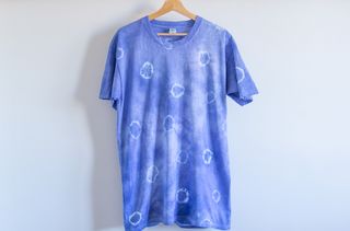 A blue t-shirt with tie dye circles