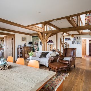 family space with white ceiling and wooden flooring