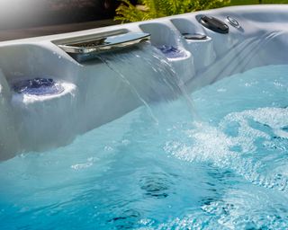 water flowing into a hot tub